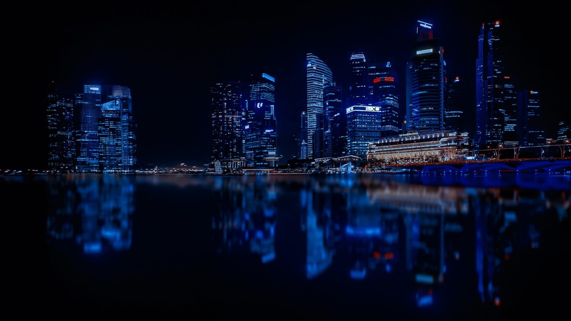 Skyline at Night With Lights and Skyscrapers Over Sea